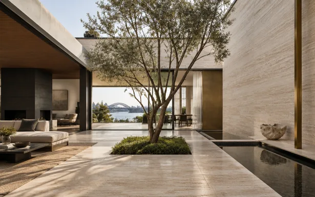 Villa courtyard in travertine with a single olive tree